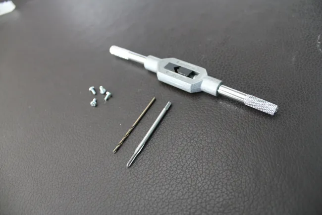 Tap holder,
tap, drill bit and screws